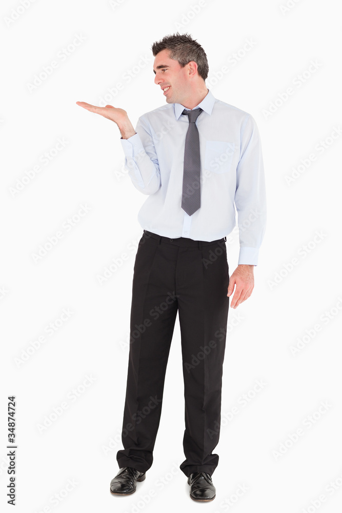 Businessman showing a copy space Businessman showing a copy space