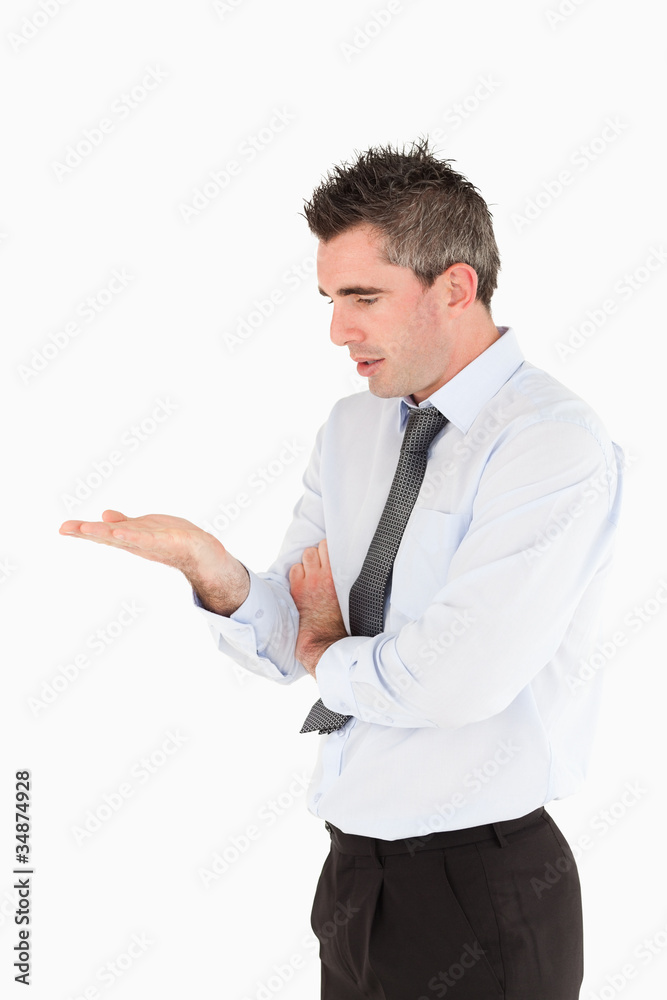 Portrait of a businessman looking a copy space on his hand Portrait of a businessman looking a copy space on his hand