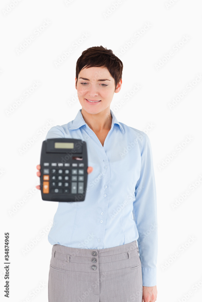 Businesswoman showing a calculator Businesswoman showing a calculator