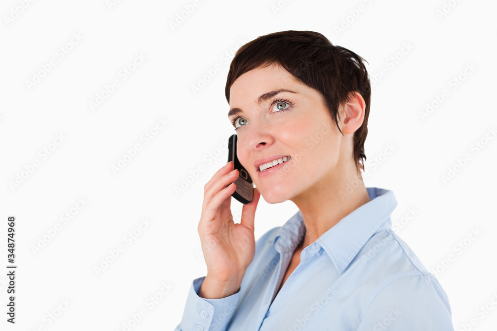 Close up of a serious woman making a phone call Close up of a serious woman making a phone call