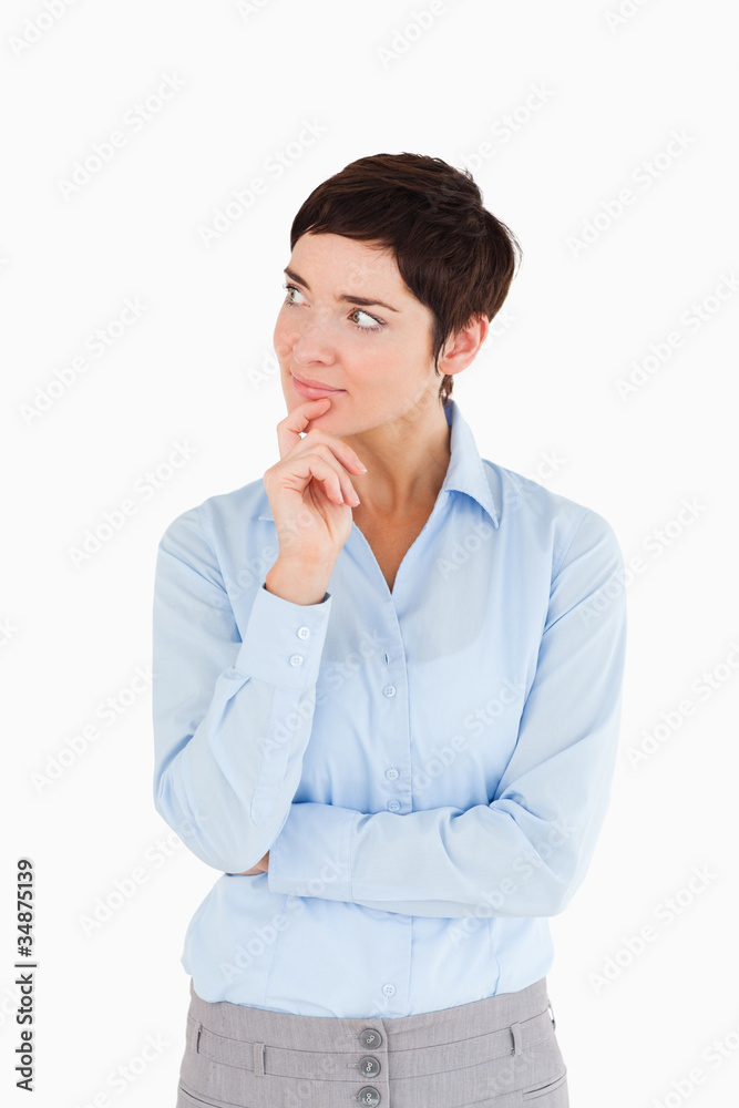 Thoughtful businesswoman with the hand on her chin Thoughtful businesswoman with the hand on her chin