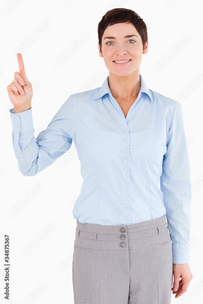Portrait of a businesswoman pointing at copy space