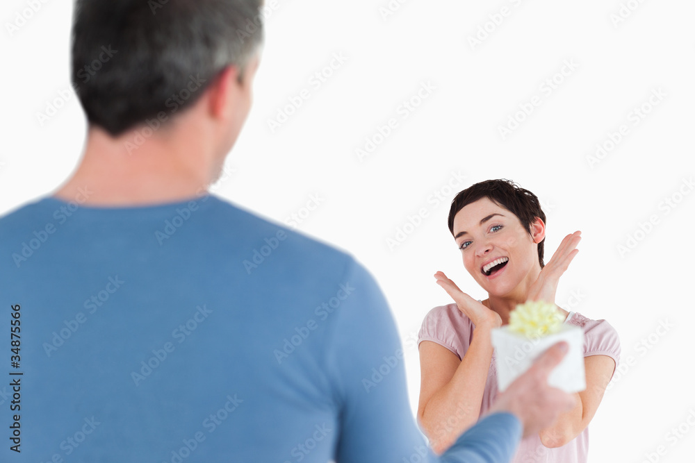 Brunette woman touched by her husband's present Brunette woman touched by her husband's present
