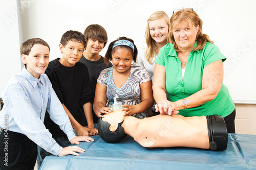 Obraz na płótnie Teacher with CPR Class and Dummy