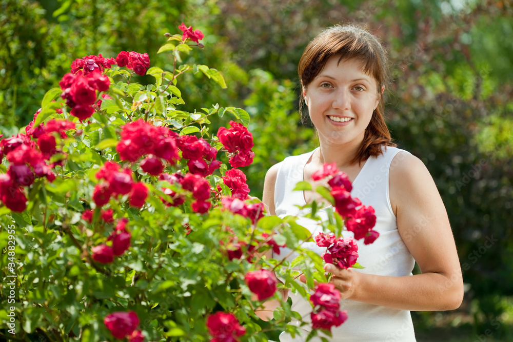 Female gardener in roses