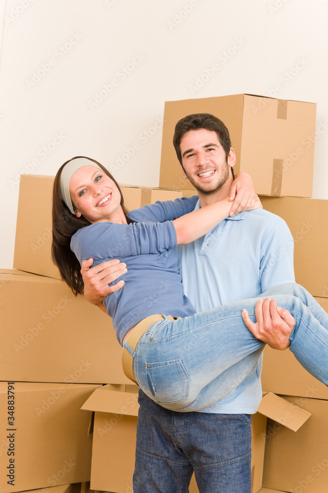 Moving new home young man holding woman Moving new home young man holding woman