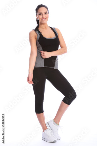 Beautiful happy athletic girl in exercise outfit