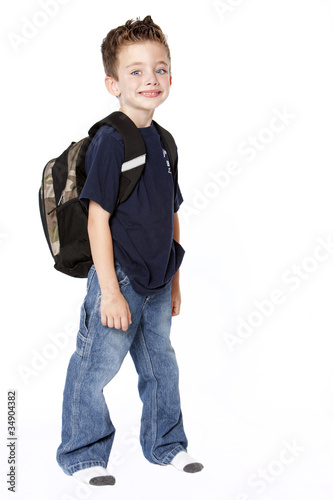 Young schoolboy with backpack photo