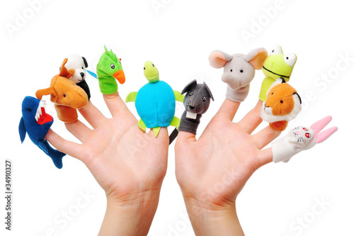 Female hand wearing 10 finger puppets photo