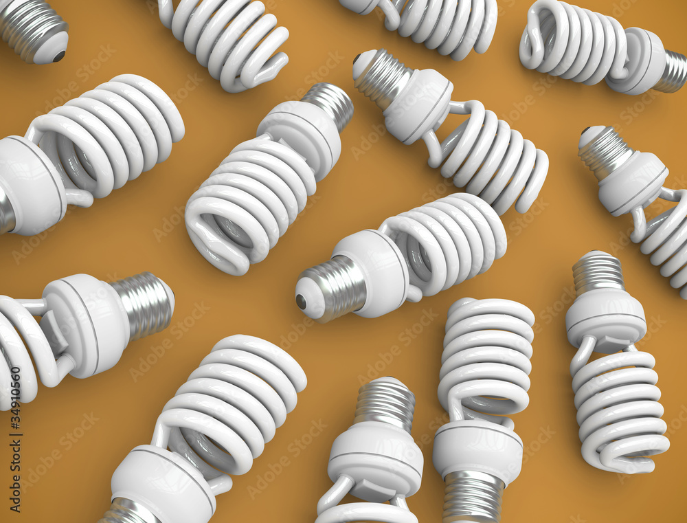 Energy efficient light bulbs on an orange plane Energy efficient light bulbs on an orange plane