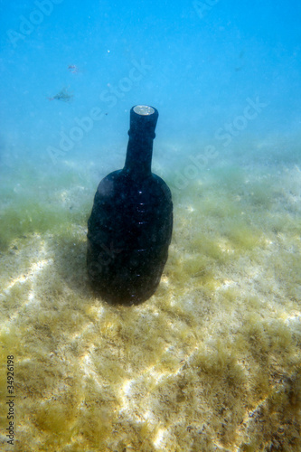 bottle of wine under the water.
