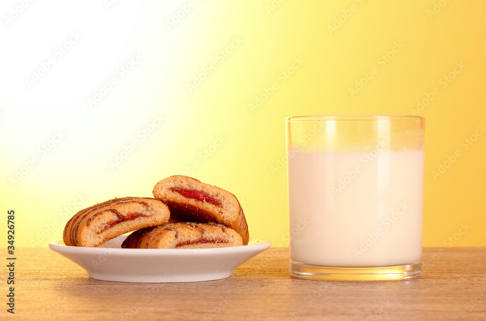 cookies with milk on yellow background cookies with milk on yellow background