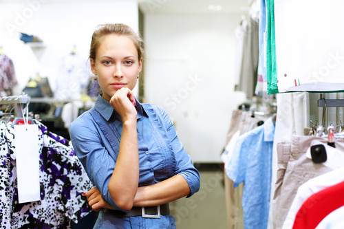 Woman in a shop buying clothes