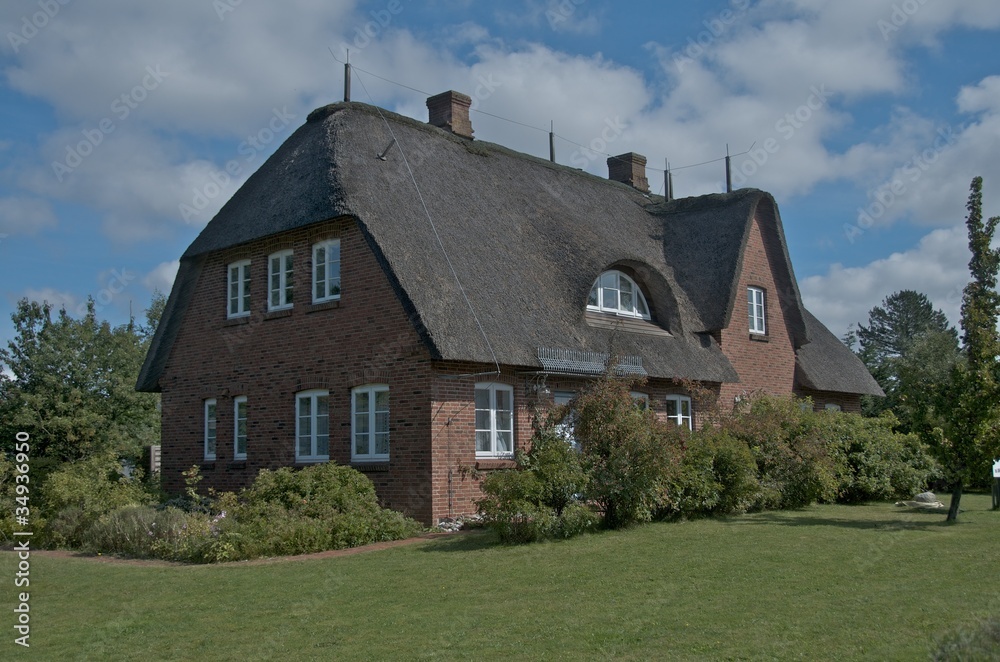 private thatched-roof house with garden