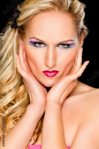 Portrait of beautiful woman with extravagant makeup. Retouched