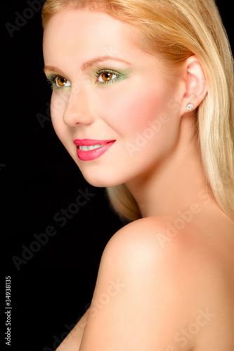 Portrait of smiling blond hair girl. Retouched