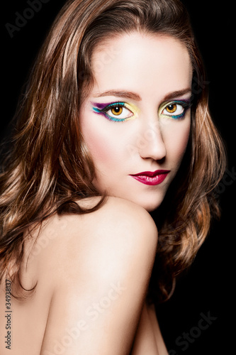 Portrait of beautiful brown hair girl with extravagant makeup.