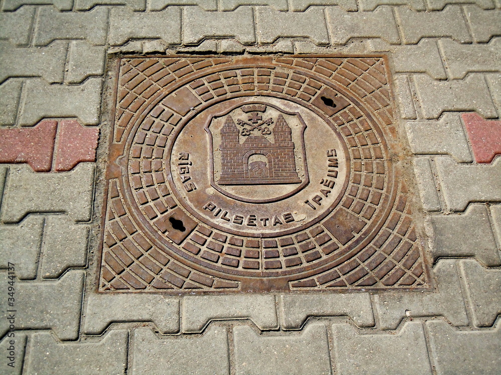 Lid of manhole with coat of arms