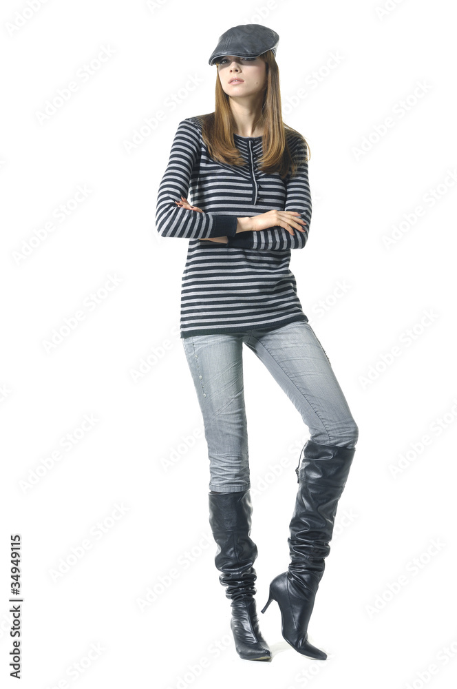 Attractive young fashion model in hat posing in the studio Attractive young fashion model in hat posing in the studio