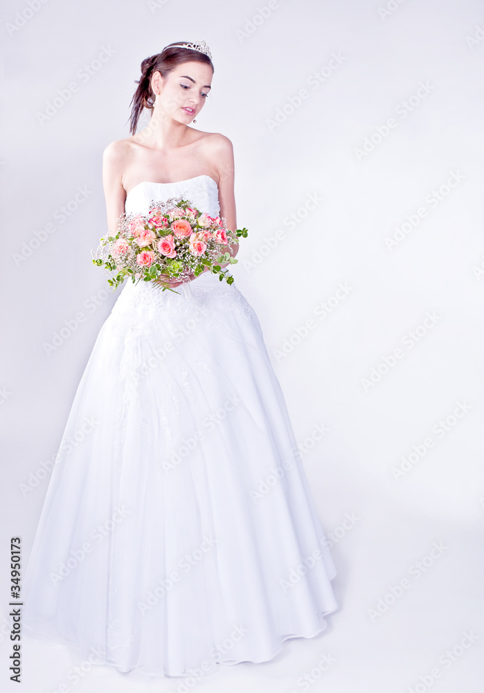 Woman in wedding dress with flowers' bouquet. Woman in wedding dress with flowers' bouquet.