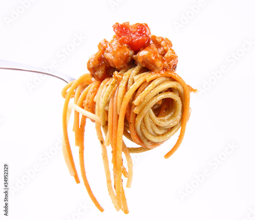 Spaghetti with bolognese sauce hanging on a fork