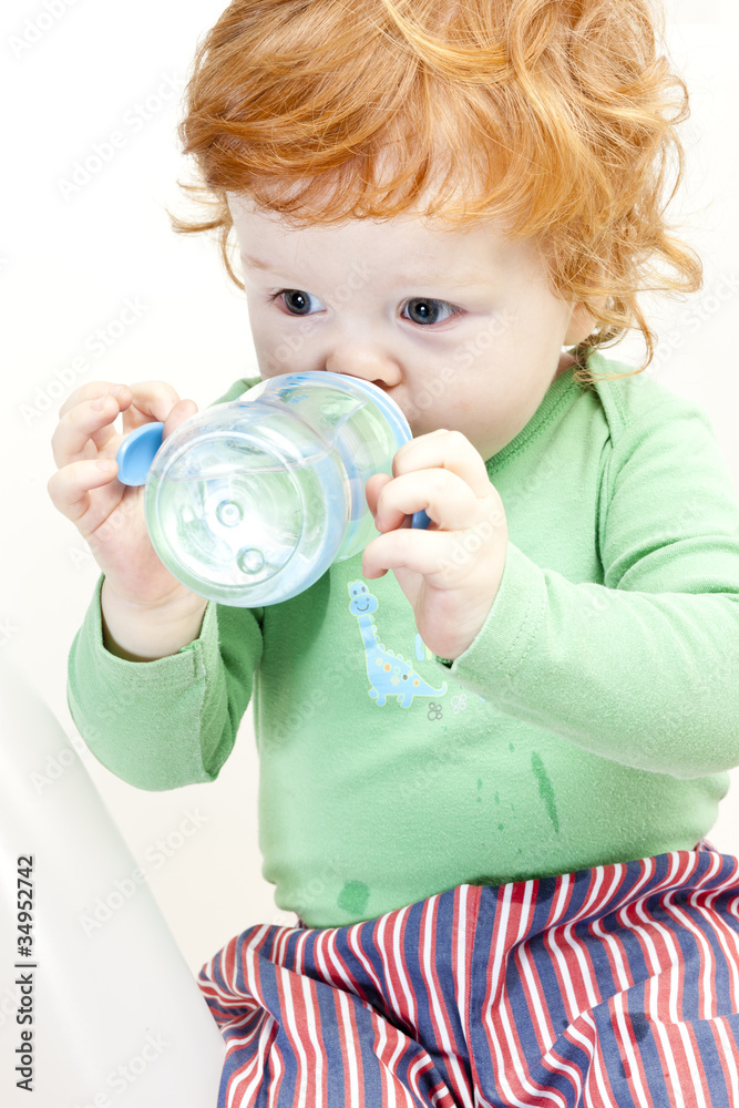 portrait of drinking little boy