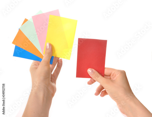 Multi-colored cards in hands