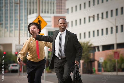 Businessmen In A Rush
