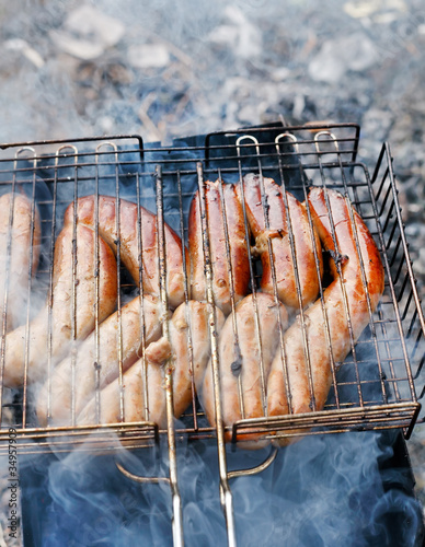 Hot sausages on barbecue