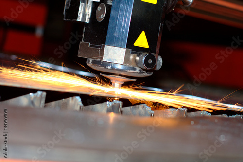 Industrial laser with sparks flying around