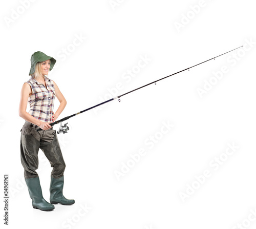 Smiling fisherwoman holding a fishing pole