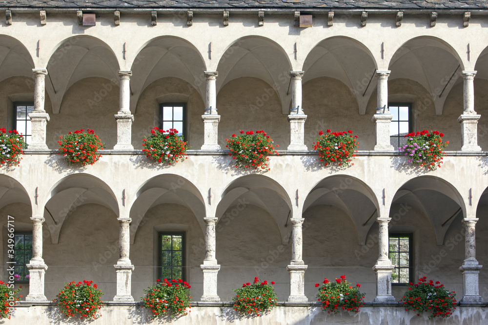 Old castle facade with arches and columns