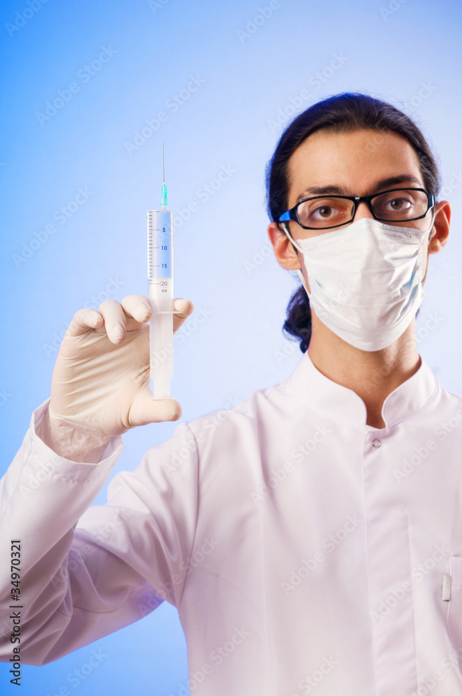 Doctor sitting at the desk on white Doctor sitting at the desk on white