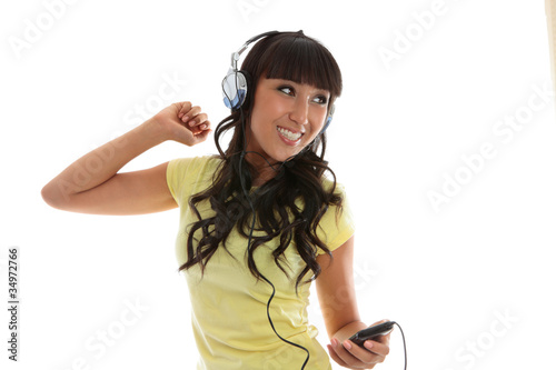 Beautiful girl enjoying music