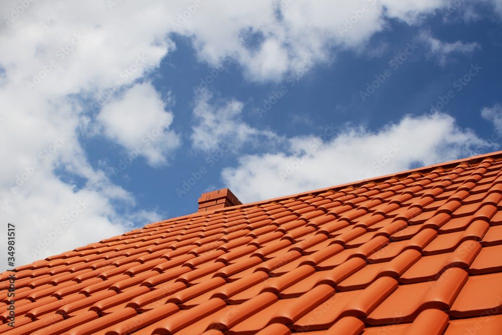 New red rooftop against blue sky