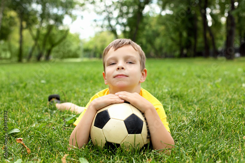 Little boy in the park with a ball © Sergey Nivens