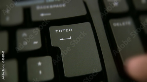 Finger pressing enter button 1