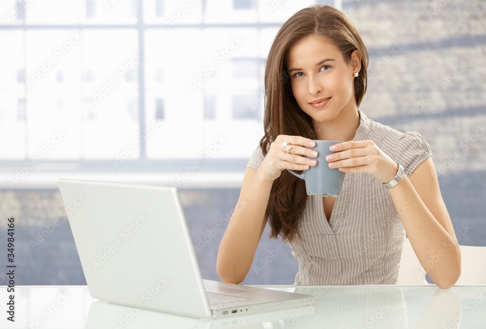 Portrait of smiling woman with computer Portrait of smiling woman with computer