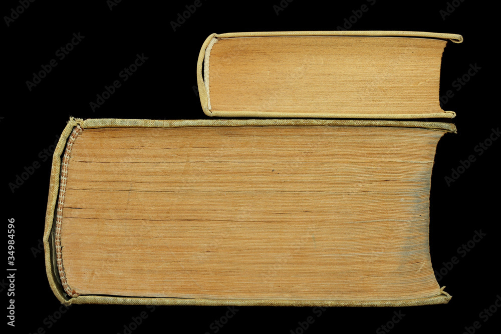 Obraz premium small old book on large old book isolated on black