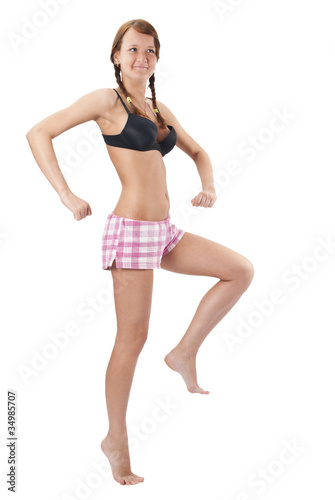 Beautiful young woman in pink shorts