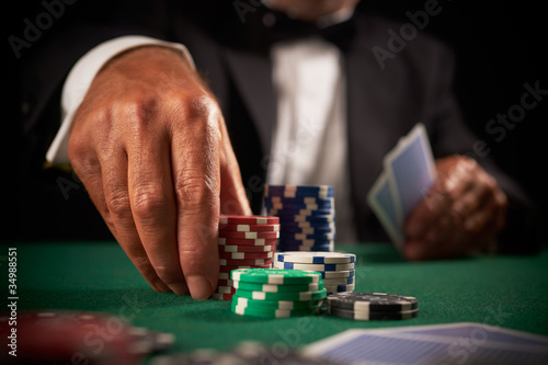 Photo card player gambling casino chips