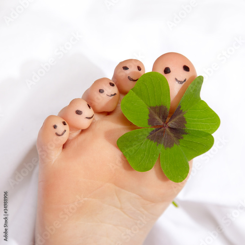 Close up of a happy foot with shamrock photo