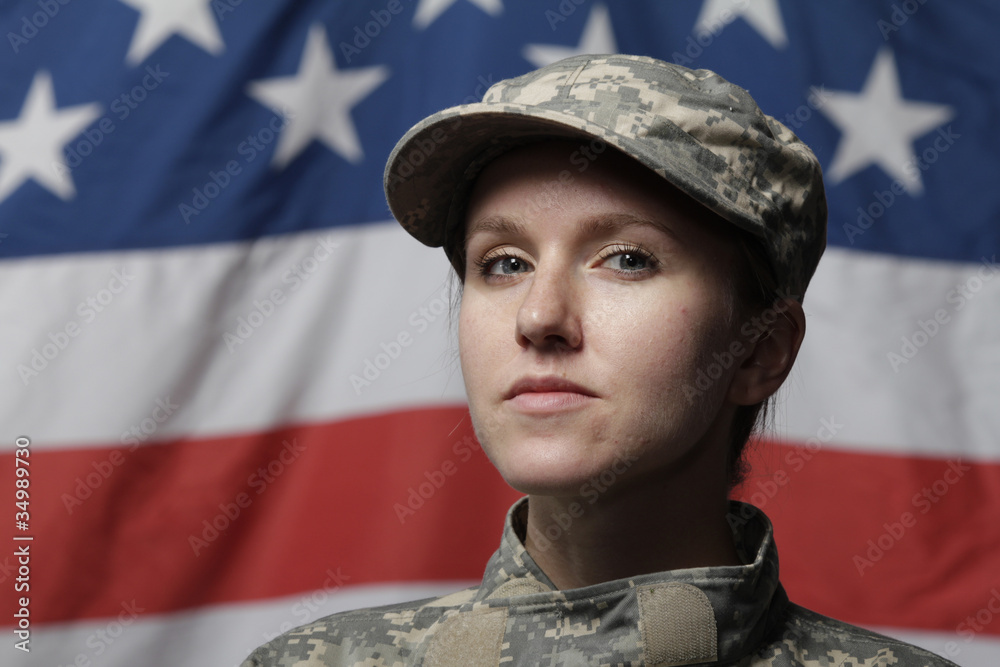 Female soldier in front of US flag Female soldier in front of US flag