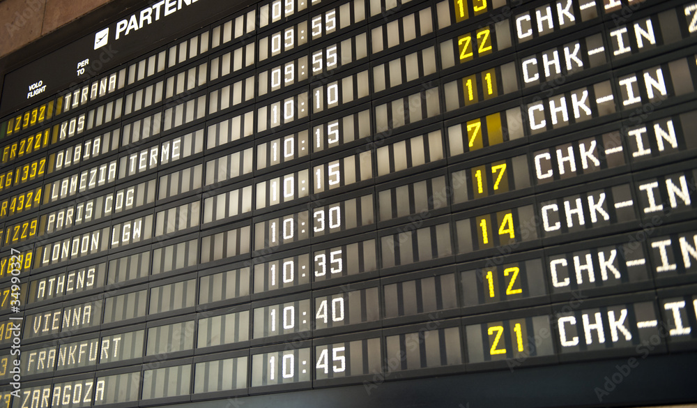 Fototapeta premium Flight information board in airport terminal