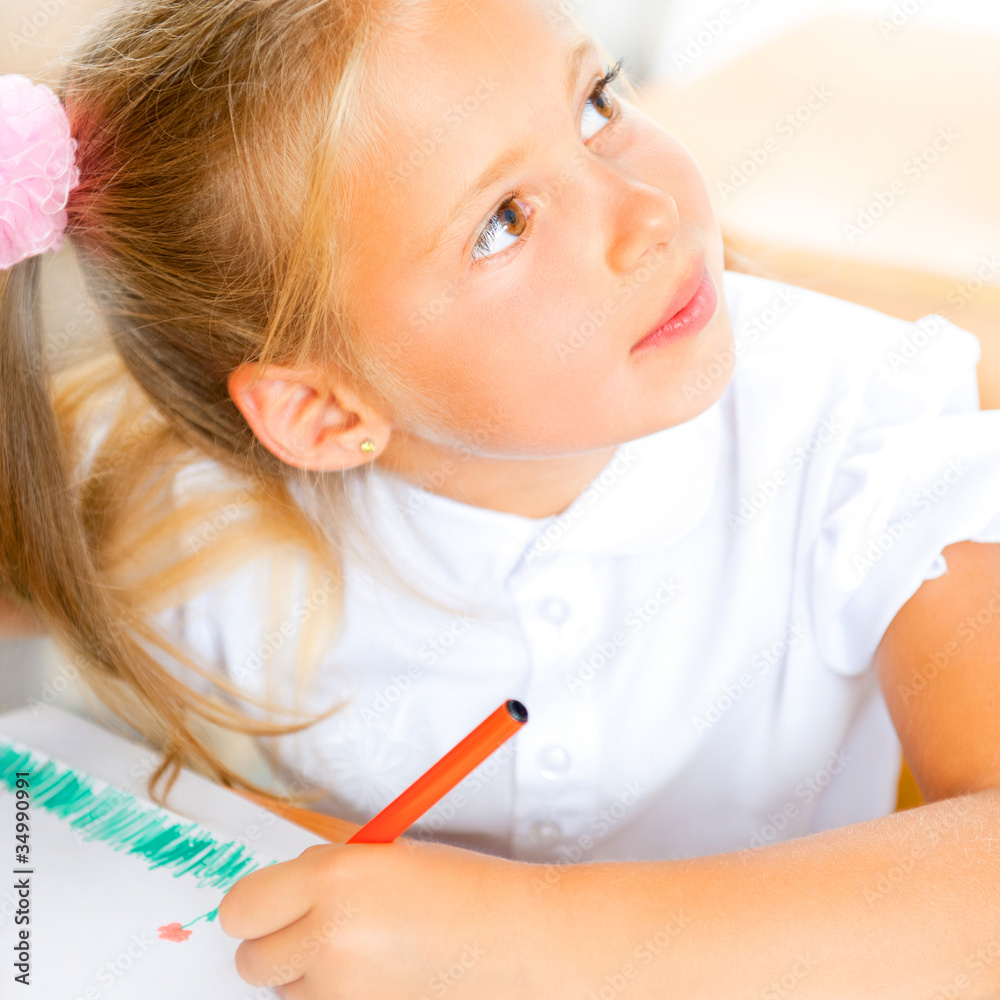 Little girl looking for a drawing concept wile painting picture Little girl looking for a drawing concept wile painting picture