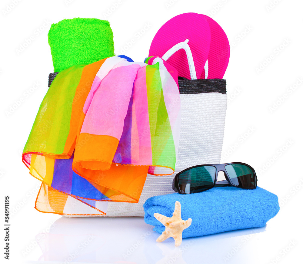 Naklejka premium beach bag with things isolated on white