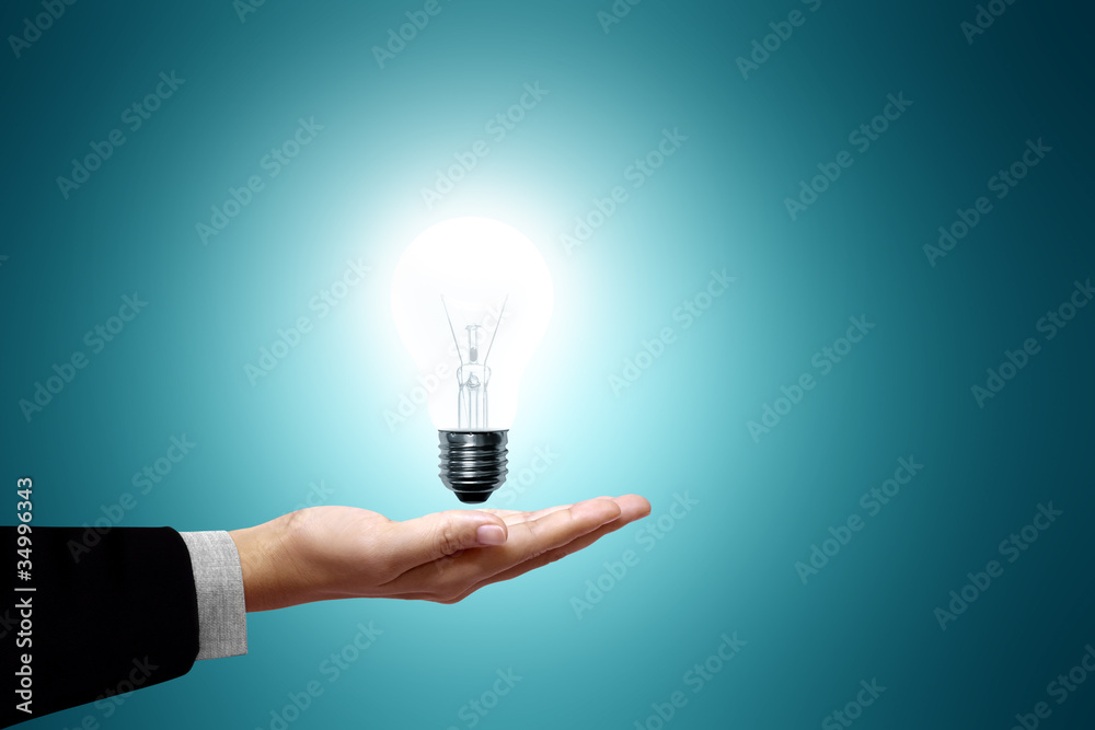 light bulb on hand businesswoman light bulb on hand businesswoman