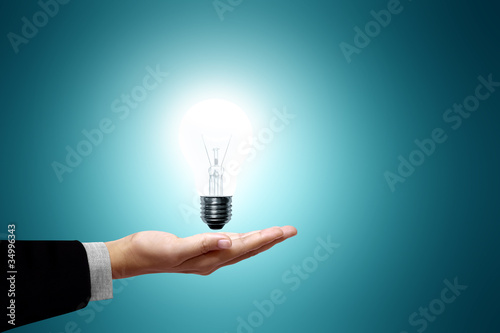 light bulb on hand businesswoman