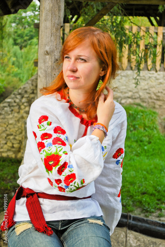 Young woman in Ukrainian national clothes outdoor