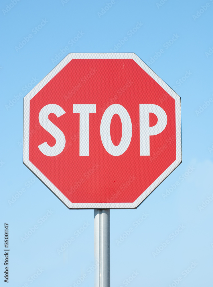 stop sign on blue sky background stop sign on blue sky background